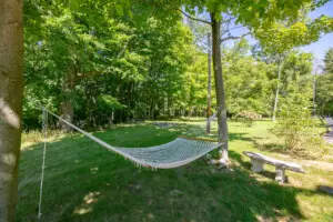 Copper Top Ridge Hammock – Peaceful Backyard Retreat Hammock in a shaded backyard surrounded by trees at Copper Top Ridge in New Buffalo, Michigan