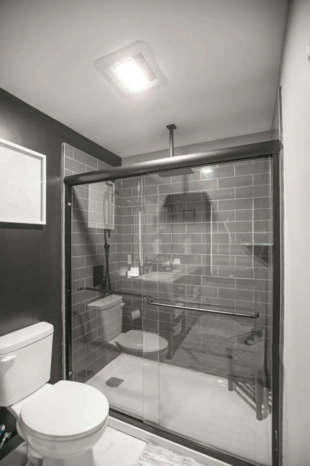 Dual-sink bathroom vanity in Lake Superior Suite with quartz countertop and wood cabinetry
