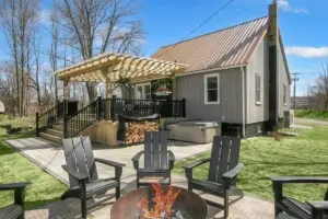 Winery Lodging Near New Buffalo – Copper Top Ridge Patio and Fire Pit Winery lodging near New Buffalo MI – Copper Top Ridge modern cottage with fire pit, hot tub, and pergola patio, perfect for relaxing after Southwest Michigan wine tours.