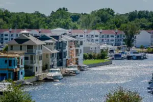 Oselka Marina – Boat & Jet Ski Rentals on Lake Michigan Oselka’s Marina Boat Rentals | Things to Do in Southwest Michigan: Powerboats docked behind sand dunes in New Buffalo harbor.