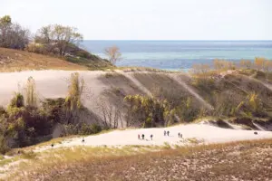 Warren Dunes State Park – Sand Dunes & Lake Michigan Views Warren Dunes State Park | Things to Do in Southwest Michigan: Towering sand dunes, Lake Michigan shoreline, and hikers exploring the sandy trails.