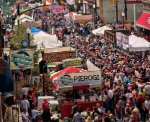 Crowds enjoying Pierogi Fest Whiting Indiana, with food vendors, festive tents, and a lively street atmosphere.