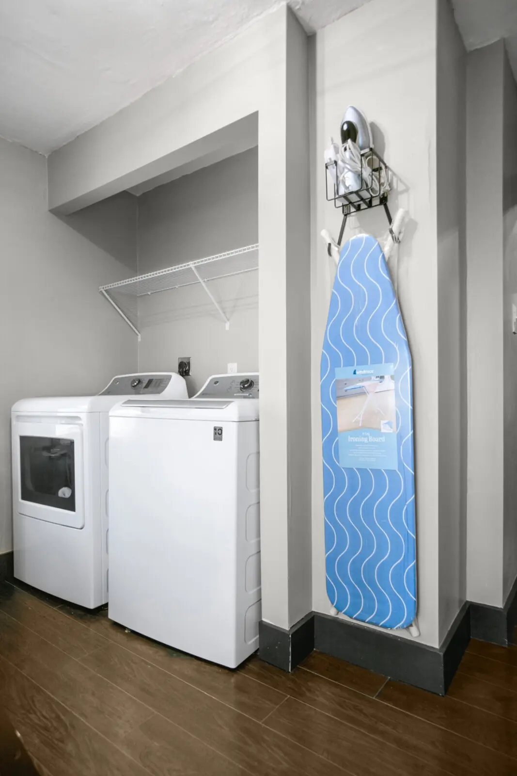 Washer, dryer, and ironing board setup in the Lake Erie Room at Copper Top Ridge