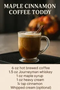 Maple Cinnamon Coffee Toddy – Cozy Thanksgiving Cocktail Maple Cinnamon Coffee Toddy on a bar mat in the Copper Top Ridge kitchen with steam rising from the mug, surrounded by maple syrup, cream, cinnamon, and a Journeyman whiskey bottle.