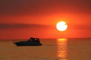 New Buffalo Sunset on Lake Michigan Boat on Lake Michigan during sunset in New Buffalo Michigan