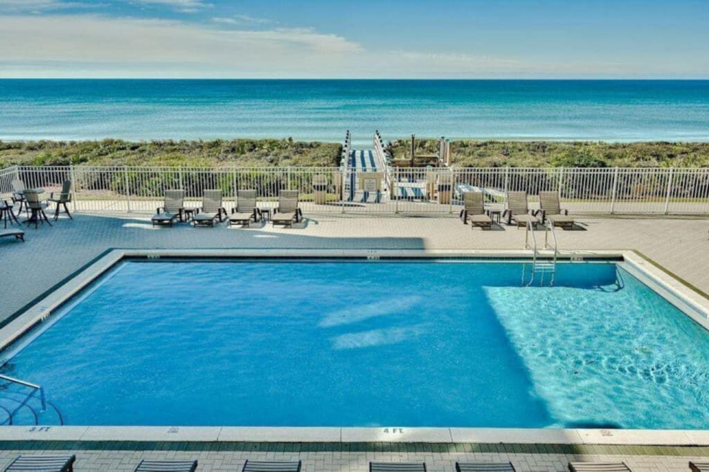 Lake Michigan poolside view with beach access, featured in Planning the Perfect Getaway blog post