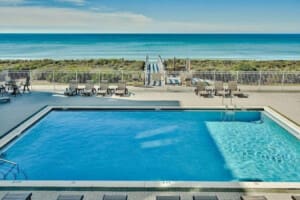 Lake Michigan poolside view with beach access, featured in Planning the Perfect Getaway blog post