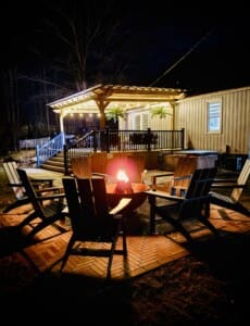 Copper Top Ridge Night Fire Pit New Buffalo MI Copper Top Ridge New Buffalo Michigan at night with fire pit, Adirondack chairs, and outdoor patio lighting