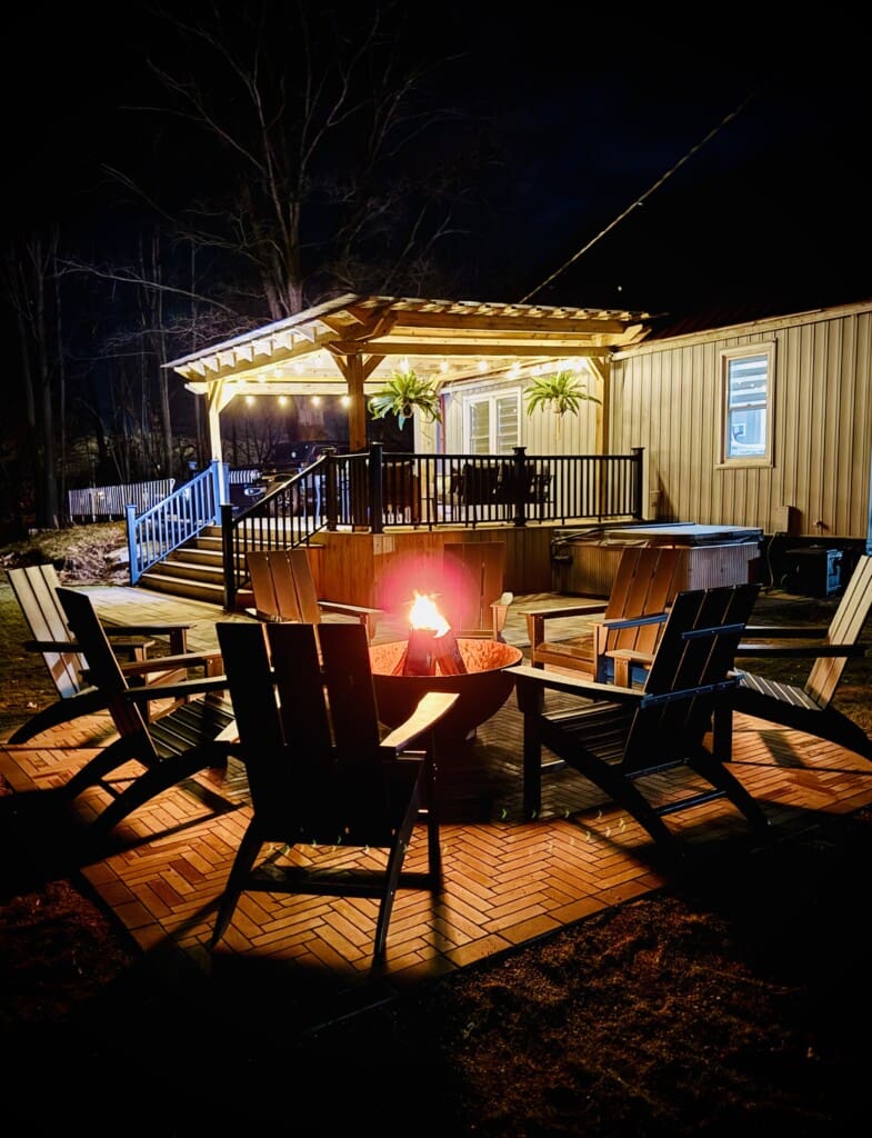 Copper Top Ridge vacation rental at night with fire pit and patio lighting, a top option for where to stay in New Buffalo MI