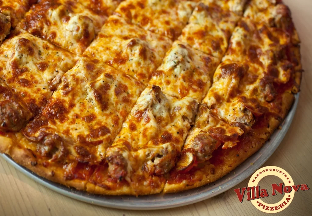 Thin crust tavern-style sausage pizza at Villa Nova Pizzeria in New Buffalo, part of the best pizza in Southwest Michigan.