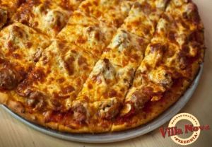 Thin crust tavern-style sausage pizza at Villa Nova Pizzeria in New Buffalo, part of the best pizza in Southwest Michigan.
